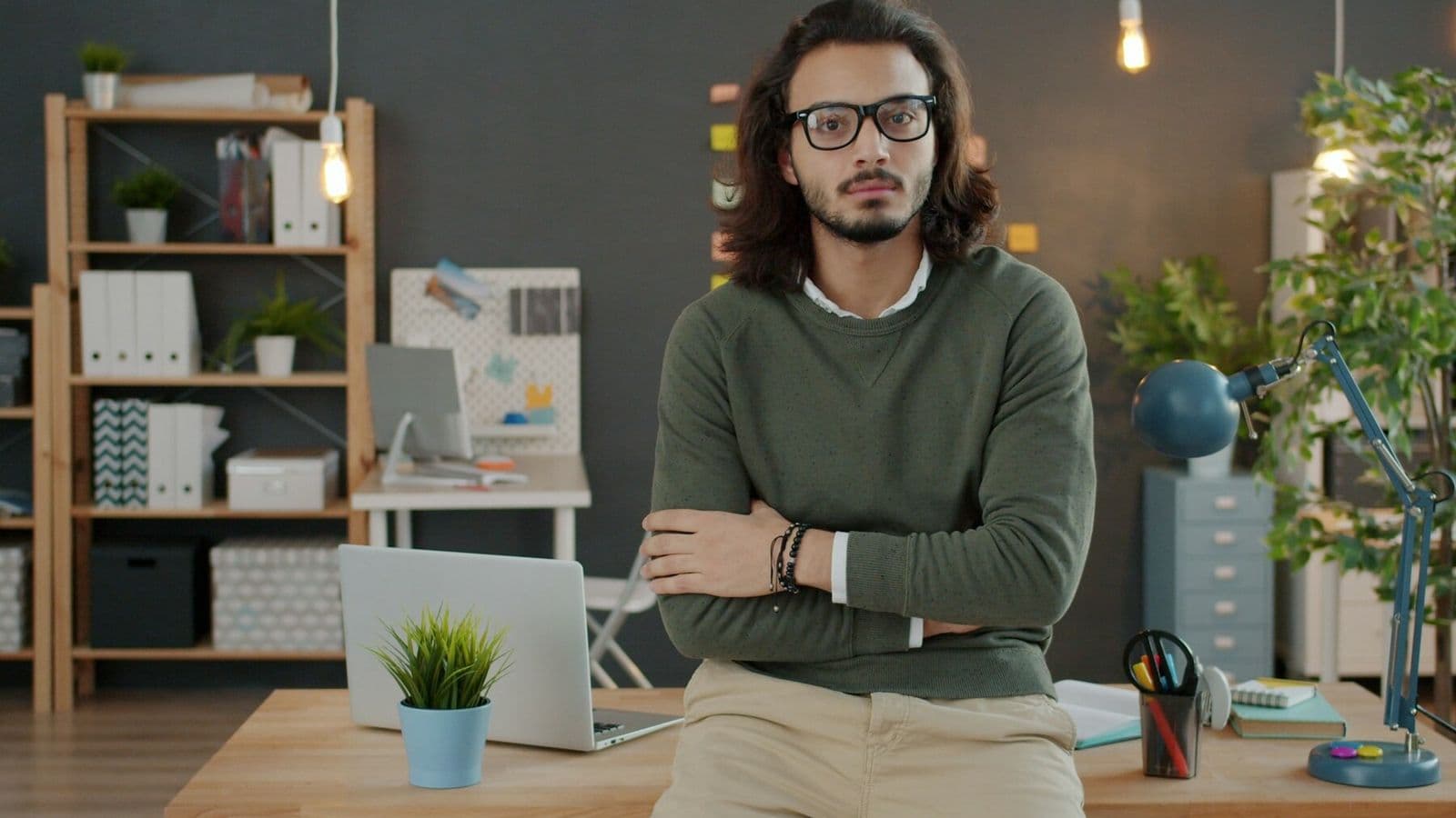 A business owner stands alone in a modern office